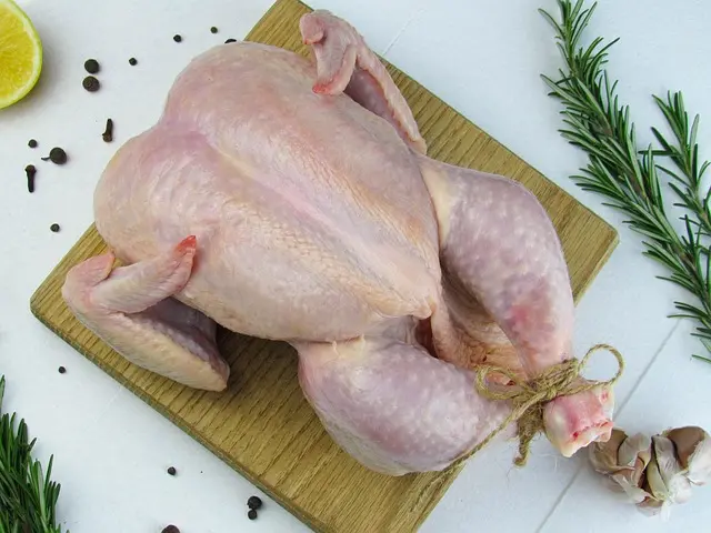 A dressed broiler weighing about 3 kg to 3.5 kg